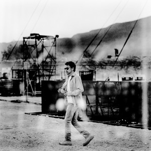 Jean-Michel Jarre walking in the dessert before his concert.